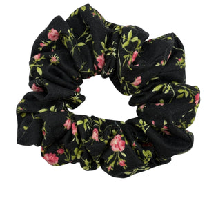 Black floral scrunchie on a white background